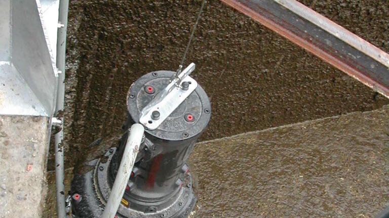 Landia submersible chopper pump feeding an adjacent gantry-mounted separator with sand laden slurry.