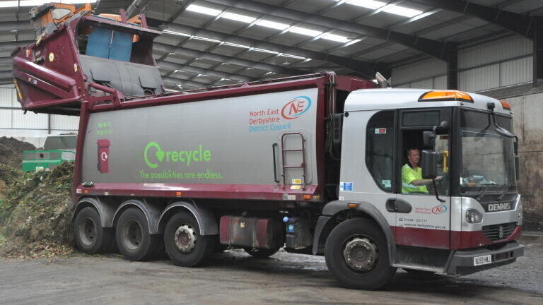 Derbyshire County Council waste vehicle dropping off a load of green waste