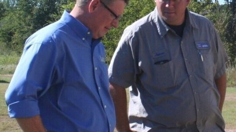 James Blodgett (right) from East Cedar Creek Fresh Water Supply District with Art Savage from Landia