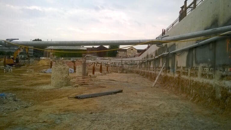 View inside a drained section of the site: the vertical steel pipes are well extensions; the water is fed to the collection basins via piping.