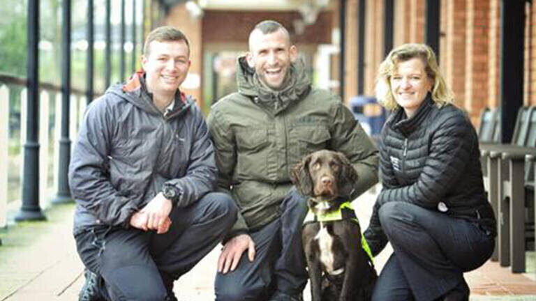 Snipe with his trainers (L-R Luke Jones, Ross Stephenson) and United Utilities leakage manager Hannah Wardle. 