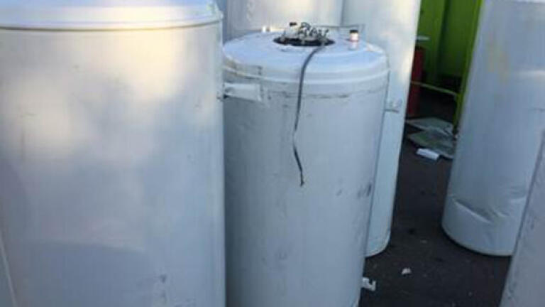 Figure 2: Boilers and hot-water storage tanks containing CFC-blown insulation foams that have been collected for treatment  [© RAL Gütegemeinschaft]